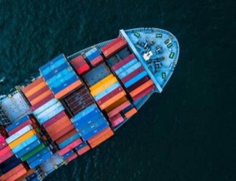 Container boat sailing, seen from the upside
